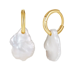 Macro shot of baroque pearl drop earrings featuring elegant golden hoops in a pair