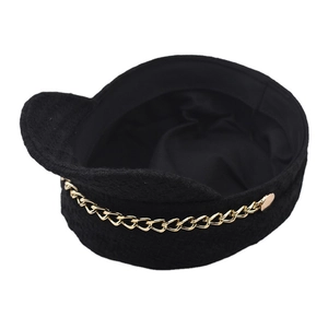 Classic black tweed baker boy hat with gold chain accent for autumn and winter fashion