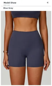 Close-up showing the blue-grey high-waist fitness shorts with elastic fabric texture