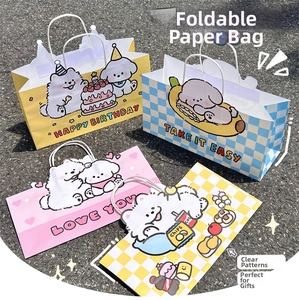 Detail of four colorful cartoon dog paper gift bags with sturdy woven handles and prints
