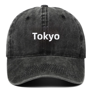 Retro washed black baseball cap featuring white TOKYO embroidery and curved brim style