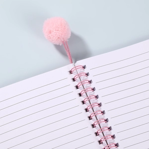 Unicorn spiral notebook with a pink plush pompom charm and ruled inner pages