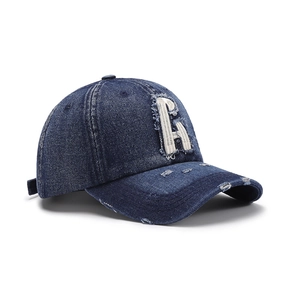 Distressed dark blue denim baseball cap with a white letter A patch and vintage finish
