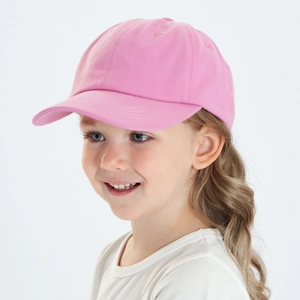 Detailed side view of a pink cotton baseball cap for kids with a classic curved brim