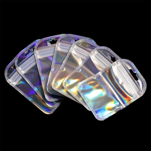 Holographic laser resealable packaging bags with rainbow reflection on black background