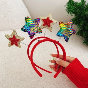 Close-up of Christmas headbands with rainbow sequins and Merry Christmas star details