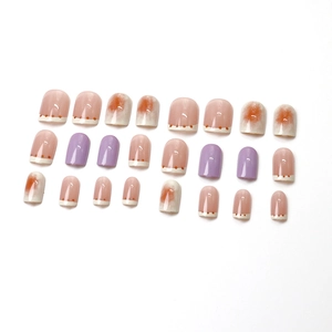 Lavender and cream French press-on nails set with orange polka dots and marble texture