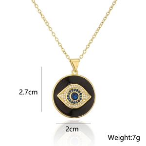 Detail view of gold Evil Eye pendant with blue zircon stones and size measurements