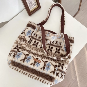 Detailed close-up of retro plush tote bag showing jacquard pattern and leather logo tag