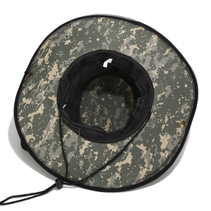 Macro view of digital camouflage sun hat featuring breathable mesh lining and side snap buttons