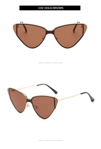 Detail view of model C02 gold metal cat eye sunglasses with brown lenses