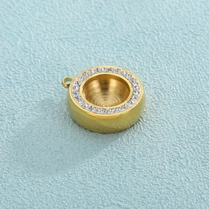 Macro shot of gold-plated pendant base with sparkling cubic zirconia bezel setting