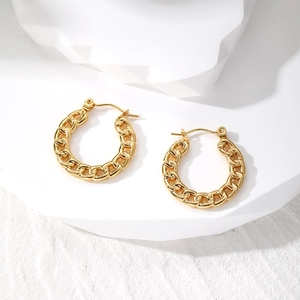 Chunky gold chain hoop earrings made of stainless steel with a bold geometric twist design