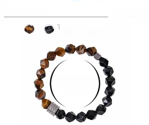 Detailing 10mm faceted tiger eye and obsidian beads with silver spacers on bracelet