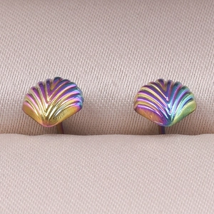 Macro shot of iridescent shell earrings with 304 stainless steel and colorful metallic texture
