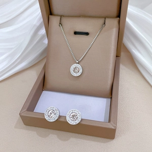 Elegant silver jewelry set with champagne gemstones and rhinestones in a beige gift box