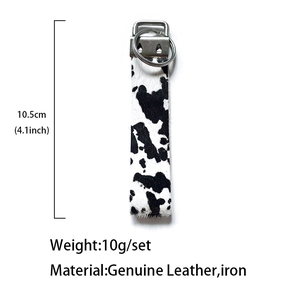 Vintage cow print genuine leather keychain pendant with black and white spotted texture