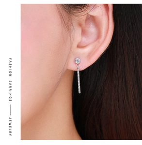Close-up of S925 silver fringe earring with sparkling pavé cubic zirconia on a model