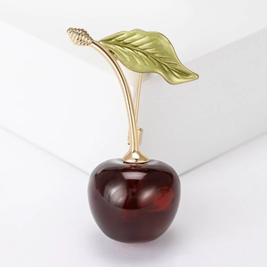 Cute cherry brooch featuring dark red resin fruit and golden metal leaf for coats