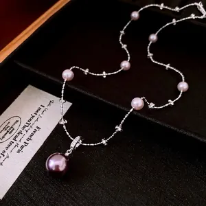 French pearl necklace with large purple pearl pendant and zircon accents on a fine silver chain