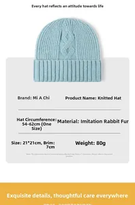 Detail view of light blue cable knit beanie showing size 21x21cm and rabbit hair blend texture