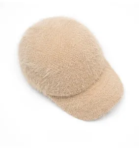 Top down view of beige knit baseball cap featuring soft faux rabbit fur texture