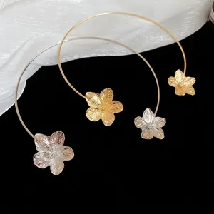 Minimalist metal flower choker necklace in gold and silver finish with textured petals