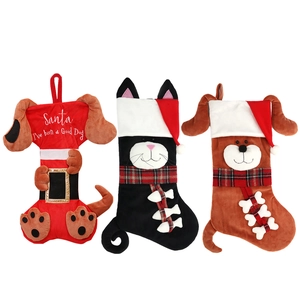 Three plush animal Christmas stockings featuring cat and dog designs with festive embroidery