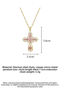 Detail of cross pendant necklace showing 3.8x2.6cm size and pink marquise stone