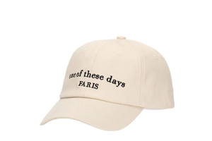 Close-up of black retro letter embroidery on beige cotton twill baseball cap