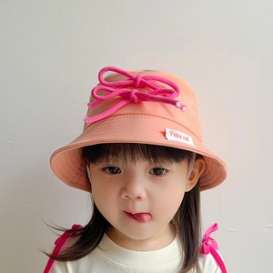 Pink toddler sun hat with a decorative dark pink bow and Fierce Cat brand label detail