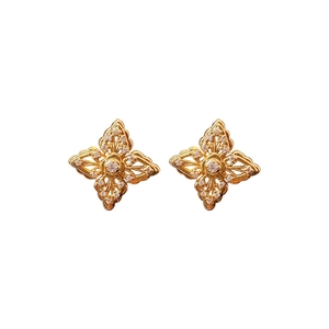 Elegant gold hollow flower stud earrings with zircon crystals on a clean white background