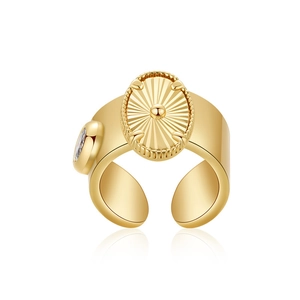 Close-up of golden sunburst butterfly ring with clear zircon and smooth reflection