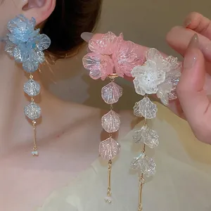 Floral acrylic tassel earrings in pastel blue, pink, and white with silver needle studs