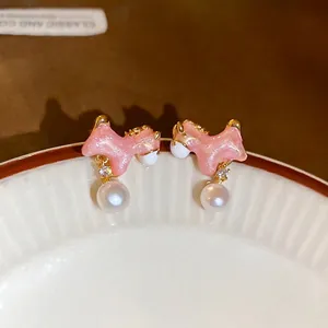 Pink glitter horse earrings with white pearls and sparkling zircons in gold plating