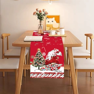 Christmas table runner with red gnome and festive tree on a wooden dining table