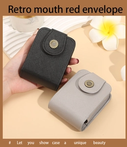 Detail of retro mini lipstick cases with daisy buckles in black and grey textured leather