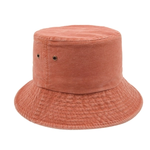 Detail view of washed cotton bucket hat showing metal eyelets and reinforced stitching