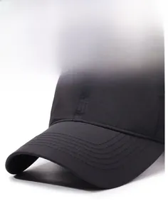 Close-up of black baseball cap brim with precise six-row stitching and textured fabric