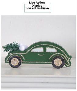 Detail of dark green wooden Christmas car ornament with gold glitter and pine needles