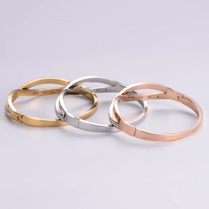 Minimalist Roman numeral bangles in gold, silver, and rose gold with rhinestones