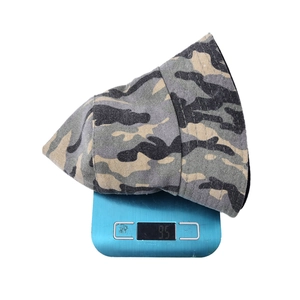 Men's camouflage bucket hat on a digital scale showing a lightweight 95g design