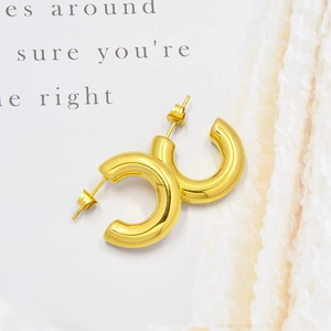 Minimalist gold hollow C-shaped hoop earrings in polished titanium steel for women