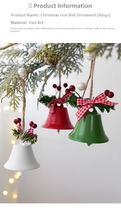 Close-up of red and green metal Christmas bells with pine needles and plaid bows decoration