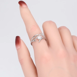 Detail of S925 sterling silver branch ring with sparkling round zircon stone on hand