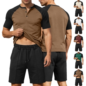 Detail view of men's color-block Henley shirt and shorts set with breathable mesh fabric texture