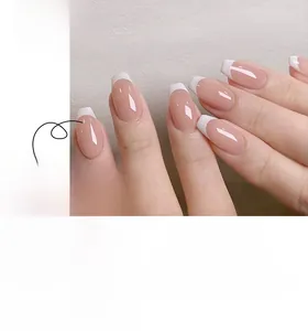 Detailed view of French ballet press-on nails with pink jelly base and white tips