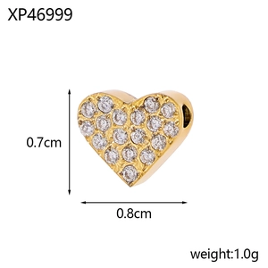 Detailed view of micro-pave heart charm with gold plating and dimensions 0.7cm x 0.8cm