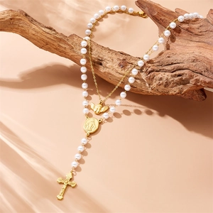 Double-layered gold necklace with angel pendant, cross charm and white pearl beads