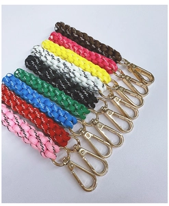 Detailed grid of multicolored handmade braided paracord keychains with gold lobster clasps